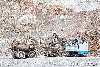 Electric rope shovel loading a dump truck Stock Photo