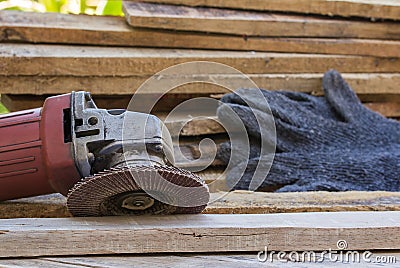 Electric sandpaper tool on wooden table Stock Photo