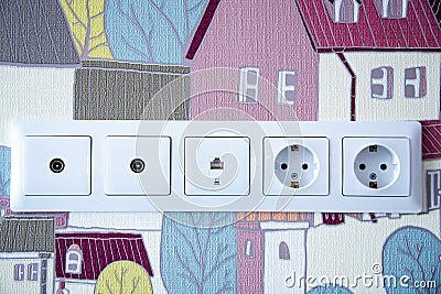 Electric sockets on color wallpaper as a background. Home decroration Stock Photo