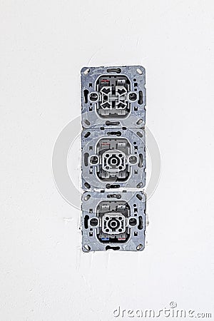 Electric sockets at a plaster wall Stock Photo