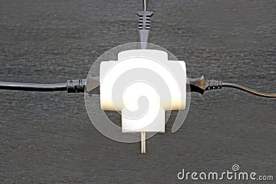 Electric tee with a plug inserted in the wire Stock Photo