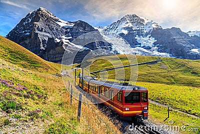 Electric tourist train and Eiger North face,Bernese Oberland,Switzerland Stock Photo