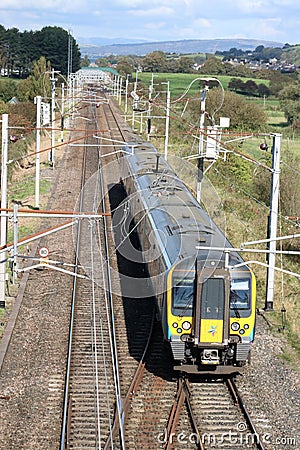 Electric unit train on straight section of track Editorial Stock Photo