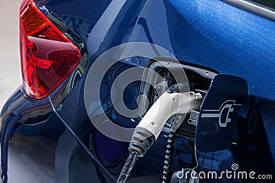 Electric vehicles and electric vehicle charging stations Stock Photo