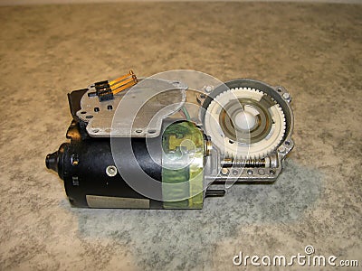 Electric wiper motor with unscrewed cover, oblique view Stock Photo