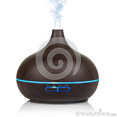 Electric wooden aroma oil diffuser isolated on white background Stock Photo