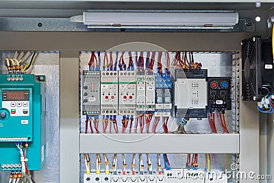 In the electrical Cabinet frequency Converter, controller, relay, thermostat Stock Photo