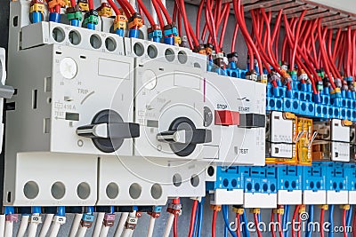 In the electrical control panel are circuit breakers protecting the motor and relay. Stock Photo