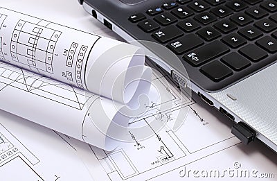 Electrical diagrams, construction drawings and laptop Stock Photo