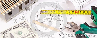 Electrical diagrams, work tools for engineer jobs, small toy house and currencies dollar, concept of building home cost Stock Photo