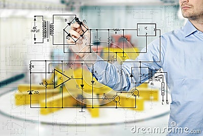 Electrical engineer draws a diagram of a circuit Stock Photo