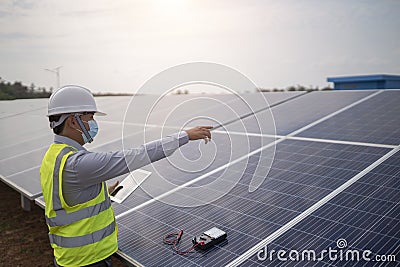 Electrical engineering works on controlling solar panels to produce renewable energy Stock Photo