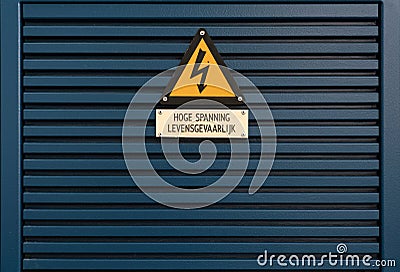 Electrical hazard sign on a triangular yellow sign Stock Photo