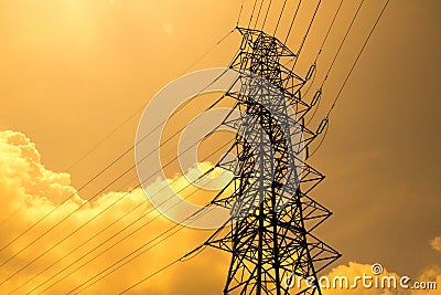 Electrical high voltage pole and cloudy sky in evening time Stock Photo