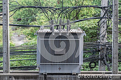 Electrical high voltage transformer on concrete pole. Stock Photo