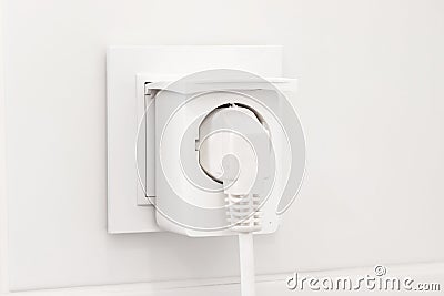 Electrical outlet with smart plug on modern bright bathroom Stock Photo