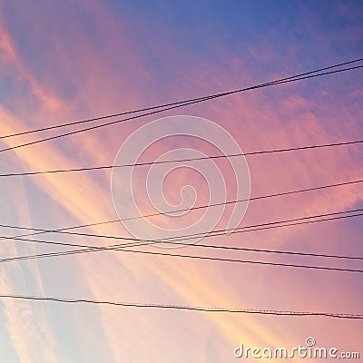 Electrical power cables and pink sunset clouds Stock Photo