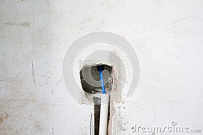 Electrical renovation work, Bury a pvc pipe in the wall Stock Photo
