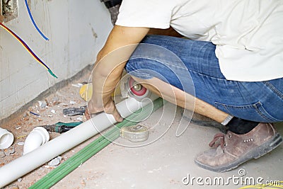 Electrical renovation work, Plumber hands working Stock Photo