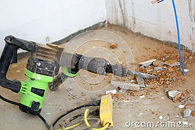 Electrical renovation work, hammer drillsin renovation room Stock Photo