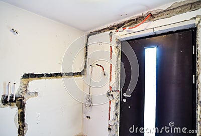 Electrical renovation work on old house installing new power lin Stock Photo