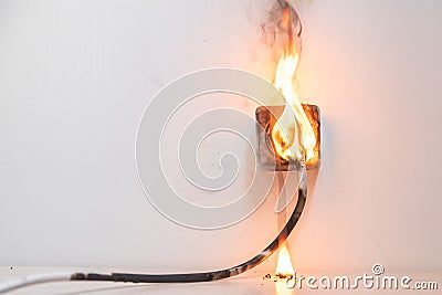 Electrical short circuit. Failure caused by burning wire and rosettes socket plug in house Stock Photo