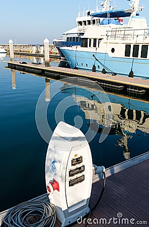 Electrical station outlets to charge ships in harbor Stock Photo