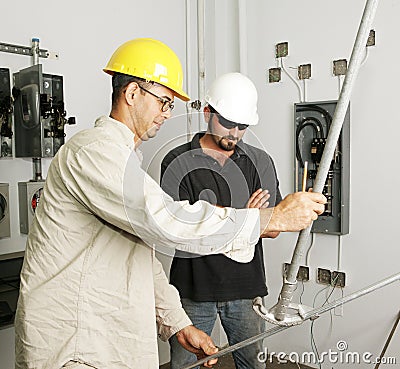 Electrical Team Bending Pipe Stock Photo