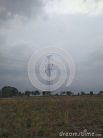 Electrical tower on field , cloudy sky background Stock Photo