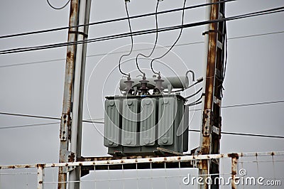 Electrical transformer mounted on electrical pillars Stock Photo