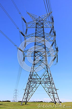 Transmission tower countryside by blue sky Stock Photo