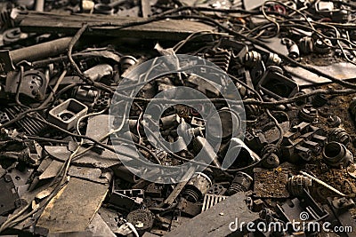 Electrical wires and components are scattered on the floor of the abandoned factory Stock Photo