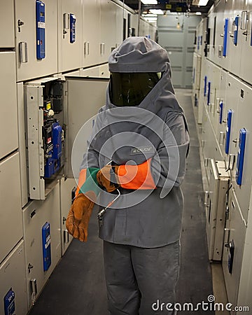 Electrical worker in protective gear Stock Photo