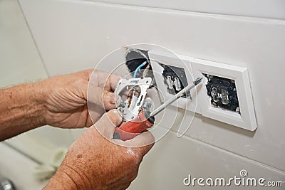 Electrican repair and installing socket, outlet plug Stock Photo