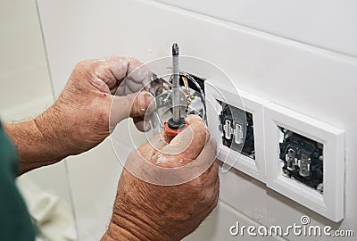 Electrican repair and installing socket, outlet plug Stock Photo