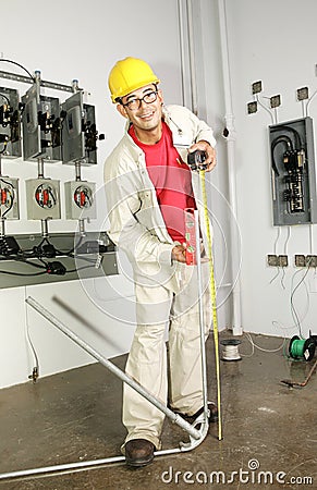Electrician Bending Pipe Stock Photo