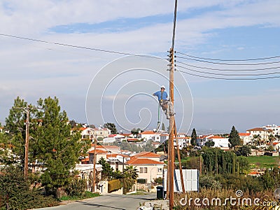 the electrician changes the lights Stock Photo
