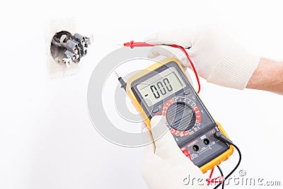 Electrician checking socket Stock Photo
