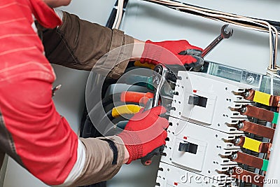 Electrician connecting power cable Stock Photo