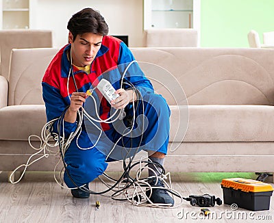 Electrician contractor with tangled cables Stock Photo