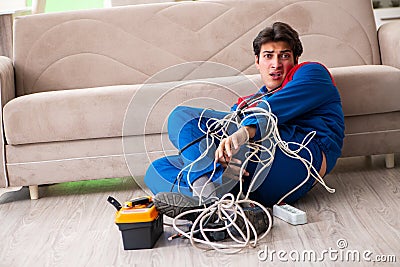 The electrician contractor with tangled cables Stock Photo