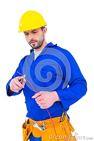 Electrician cutting wire with pliers Stock Photo