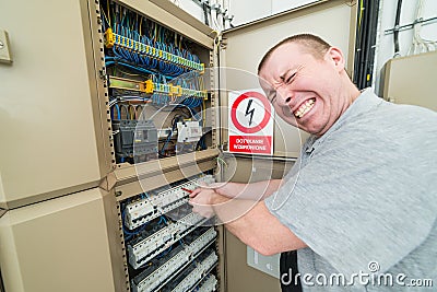 Electrician electrocuted Stock Photo