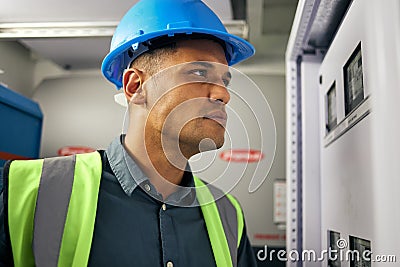 Electrician, engineering and technician with man in control room for inspection, quality assurance and energy Stock Photo