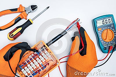 Electrician examining, control fusebox Stock Photo