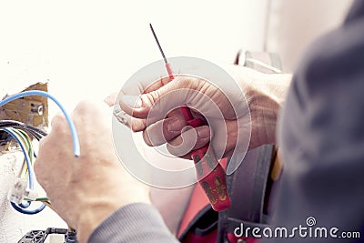 Electrician hands Stock Photo