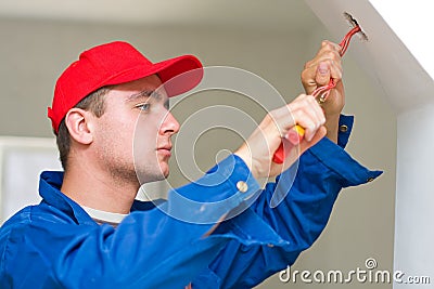 Electrician installing lights Stock Photo