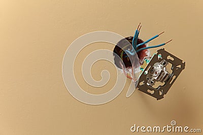 Electrician installing a power socket Stock Photo