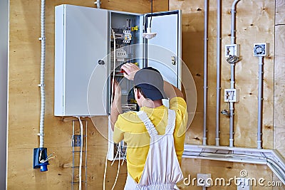 Electrician makes wiring Stock Photo