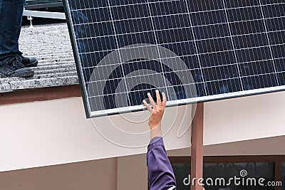 Electrician male working transport solar cell prepare for install aluminum rail . professional technician worker setting connect Stock Photo